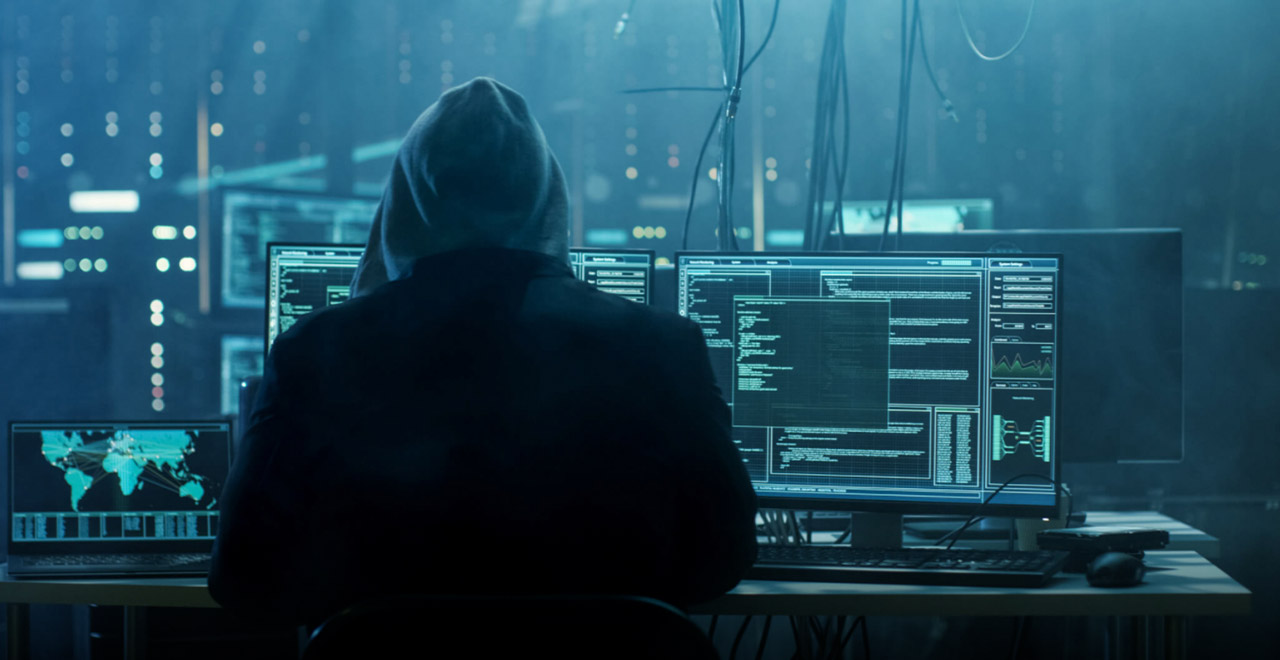Hacker-in-hoodie-in-dark-room securing WFX